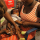 A child at New Tafo Hospital being given a yellow fever vaccine shot after a drone delivery